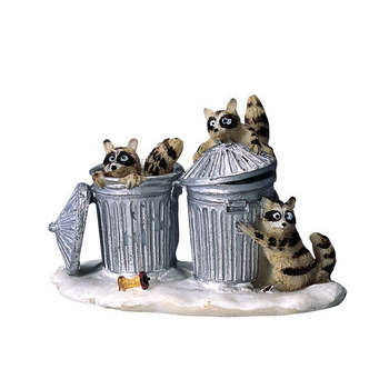 Figurine de Noël : Raton laveur intéressé par les