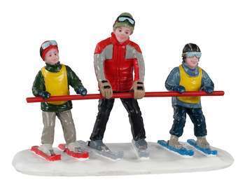 Figurine de Noël : Skieurs débutants en piste sur